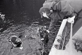 Divers from the UBC dive club cleaning up bottles and cans from the bottom of Sasamat Lake