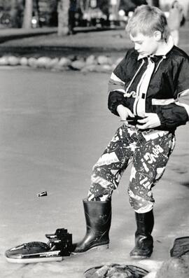 Playing on the frozen lake at Como Lake park with his Mini Typhoon Hovercraft is Brian Langley (7 years old).