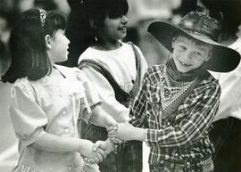 7 year old Kyle Wilson seems a little shy with his dance partner at Douglas Road Schools Harvest time festival.