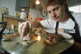 Wayne, of Today's Music, who repairs musical instruments, including drums and guitars