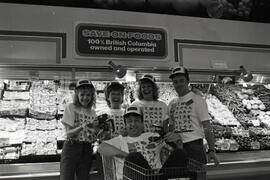 Save-On-Foods employees wearing their summer games t-shirts at work