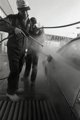 Jamie Askew and Peter Chand washing cars at the Husky Car Wash at Landsdown and Lougheed, Boxing Day.