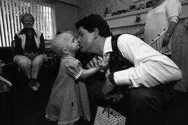 Victor Warren from London, England, getting a big kiss of appreciation from Chelsea Spencer
