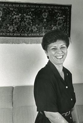 Woman standing in front of a couch
