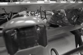Dave Dunn admires a Stinson Reliant model plane at radio control display in Westwood Mall