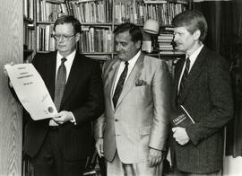 Mayor Sekora looking at a document