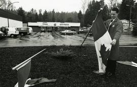 Vandalized flags. Steve Oram of Trail Appliances with damaged flags.
