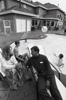 Builder Dale Gorcak and his staff around a pool at the Street of Dreams