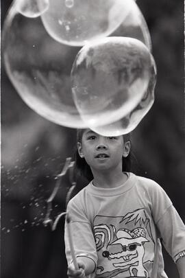 Joyous kids make giant bubbles at Child Development Society's annual picnic at All Saint's Church Hall