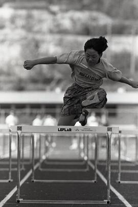 Action shot of hurdles competition at 20th annual Como Lake Relays, track & field meet for Coquitlam elementary schools