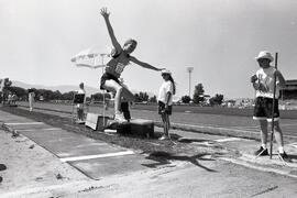 Melanie Kerr attempting the girl's triple jump at the B.C. Summer Games