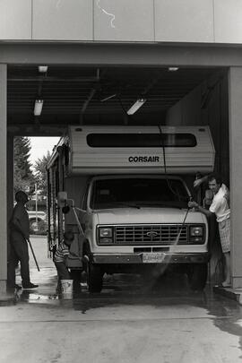 4 year old Kyle Beach helping his father and grandfather wash an RV at 232 Street and Dewdney Trunk Road