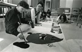 Students painting a banner