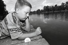 Casey Giesebrecht fishing with just a line and a hook at Como Lake