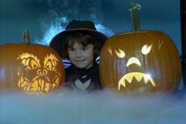 Studio pic of girl with Halloween pumkins in color