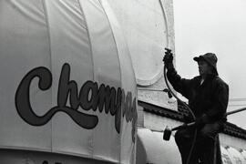 John Lentng doesn't let a rainstorm stop him from cleaning awning at Champagne's restaurant in Coquitlam