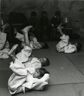 Mrs. Throwers' judo class in the basement of the Social Recreation Centre