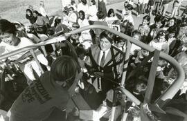 Mayor Lou Sekora is mobbed by Miller Park Elementary students as he prepares to cut the ribbon, opening a new playground at the school.