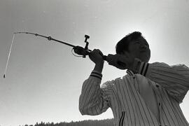 Lee Chun-Ching casting his line from the pier at Belcarra Beach