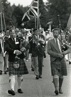 Pipers lead a parade for the seniors games