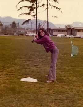 Doris Champagne playing softball - 1975