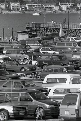 Parking lot by a dock filled with cars somewhere in the Tri-City for a story on holiday Mondays in the area