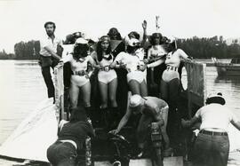 Women in costume on decorated barge