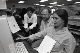 Dixie teaching the production staff how to use the new computer program