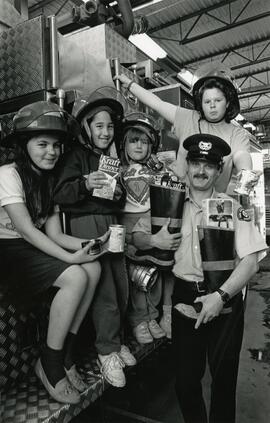 Children and firefighters food drive