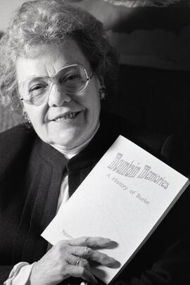 Normal Campbell with her book on Burke Mountain
