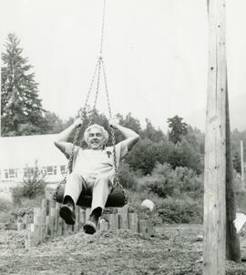 Senior on a tire swing