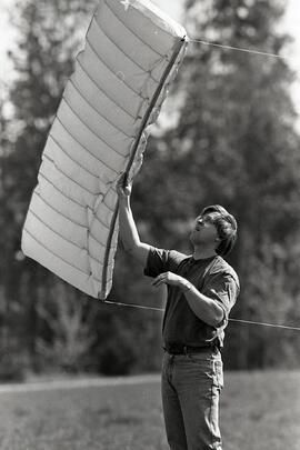 Russell King tries to get air to fill his Flexi-Foil Kite on a breezy day at Lafarge Lake