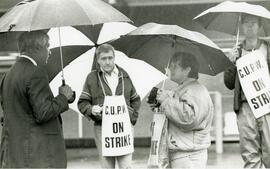 PoCo Mayor Len Traboulay talks to pickets at PoCo post office Wednesday