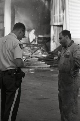 RCMP talking to the owner of a welding shop that caught on fire