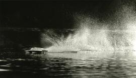 This R-C hydro plane is stirring up a stream over calm waters of Lafarge Lake.