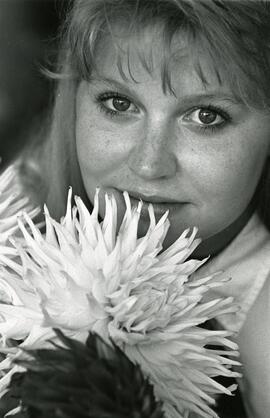 Sarah Young of Coquitlam smells giant dahlia at the P.N.E. Horticulture display