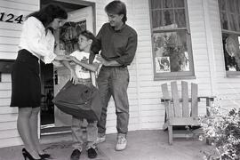 News carrier at the front porch of a block parent. Metro Valley ad campaign. Dave Jenesson.