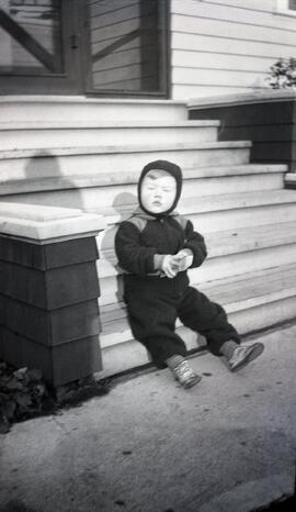 Brian Bovet sitting on stairs in winter