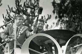 Coquitlam Mayor Lou Sekora and BC Gas' Ted Schelleberg light the torch