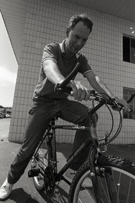 Ron Burge receiving a bike from businesses in the Tyner industrial park