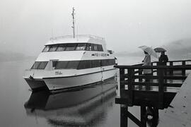 Pride of Vancouver docks at Port Moody pier at Rocky Point as city officials watch