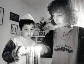 Oz and Debbie Harusha lighting the Chanukia