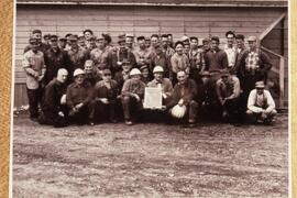 Group of work men at mill