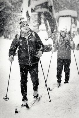 Alex Fritz and Ellen Sangster ski along Guildford St.