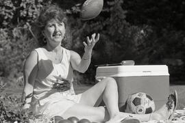 Jeannie Trasolini enjoying a faux picnic in her backyard to promote the Chamber of Commerce picnic