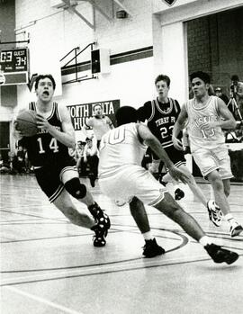 Jason McIvor Terry Fox Ravens (14) slips around Benji Heran N.D. Huskies (10)