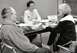Pharmacist Bev Harris answers questions from Roy and Jean Wilcox during Brown Boy seminar