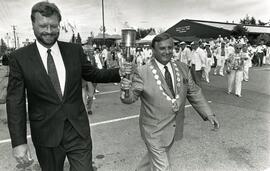 BC Gas' Ted Schellenberg and Mayor Lou Sekora take the torch
