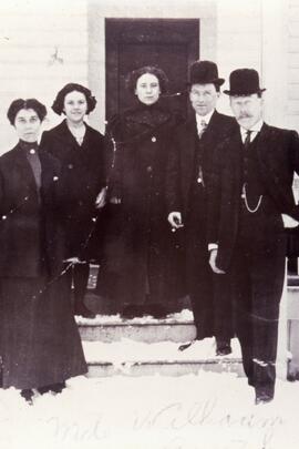 People standing in front of a door