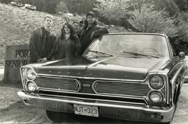 Teenagers with a vintage car
